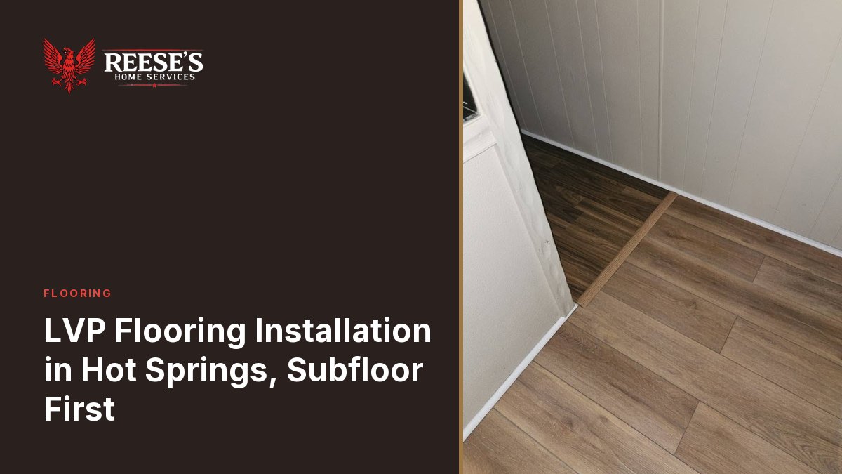 Light oak LVP running through a doorway on a wood transition strip, with new white baseboard.
