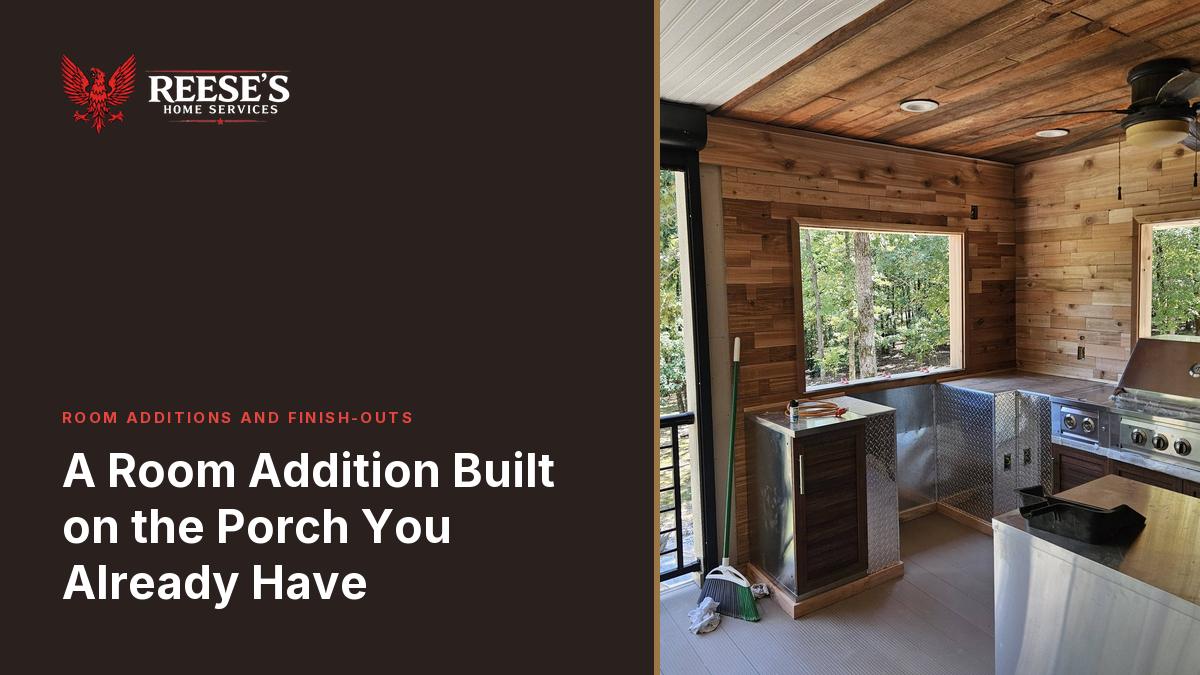 Cedar-lined porch room with a stainless counter run, a built-in grill and a bar sink at the window.